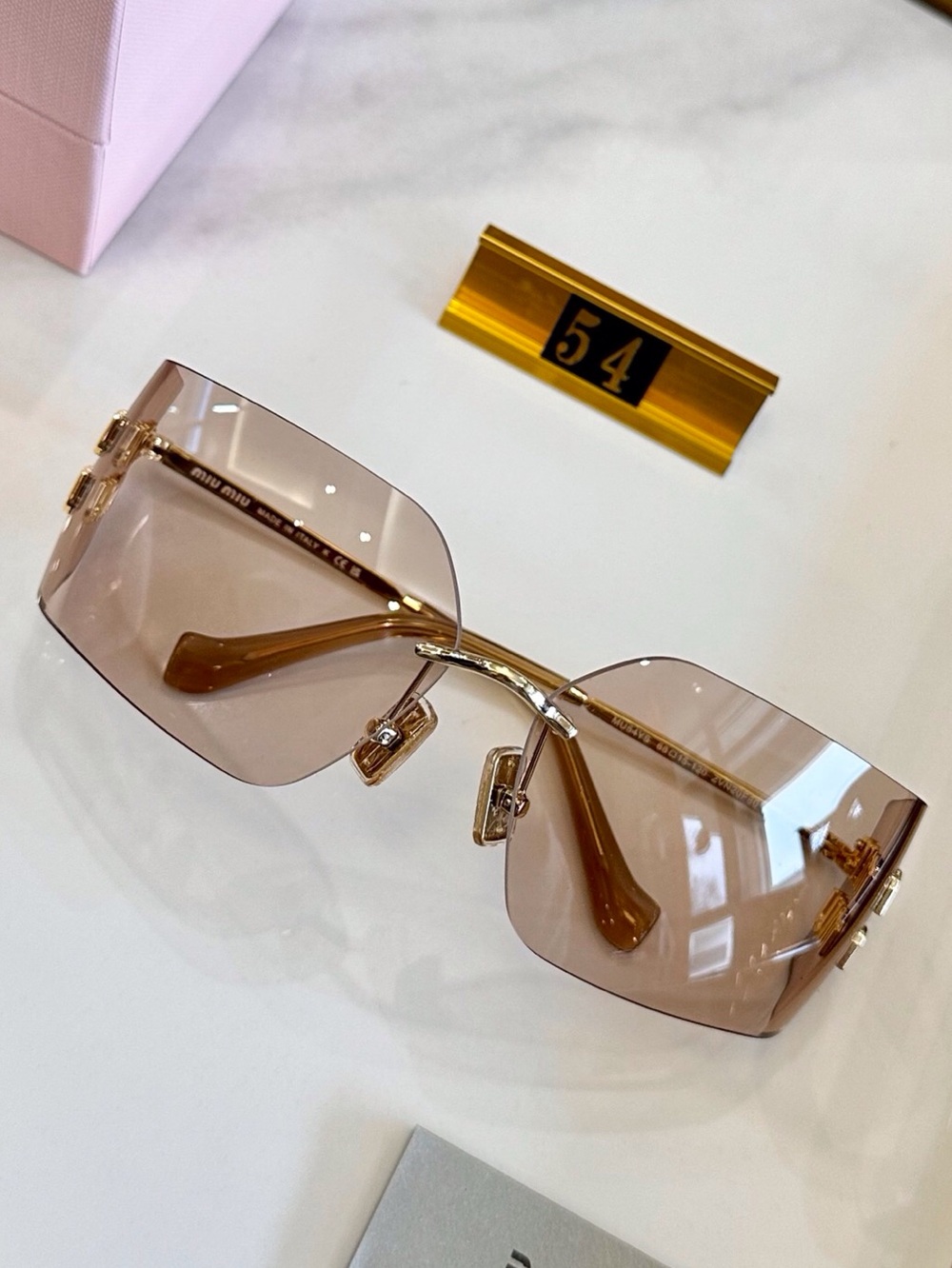 Miu Miu Rimless Sunglasses with Pink-Brown Lenses and Gold Accents - Picture 2 of 8